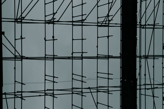 Close up of scarfolder on a construction site taken. Toned colours, blue and black.