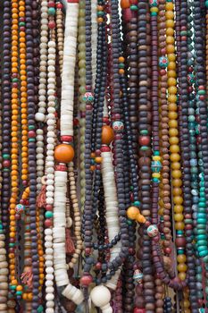 Prayer chains in a local shop . Various photographs of Lhasa in China