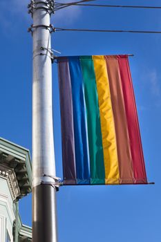 Street gay flag within the 'Castro' area in Francisco which is the famous Gay and lesbian district. The rainbow flag is the  symbol used by the Gay community.