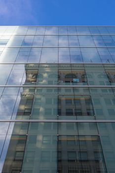 Corporate Modern Offices Building with the reflection of the sky and of an old-fashioned building in San Francisco, 2012.