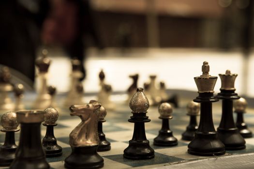 Close-up of a Chess game in the street of San Francisco with blurred background and old style colors