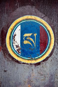 Tibetan door sign painted on a wall of temple in Tibet