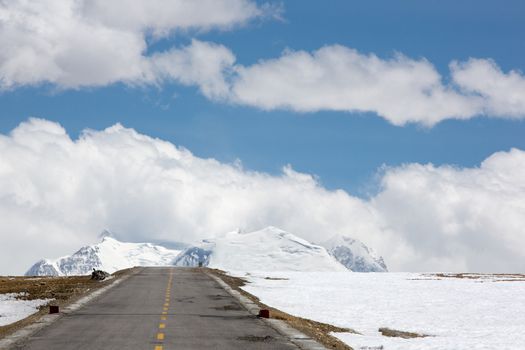 Straight road to Himalayas range on the Friendship Highway in Tibet