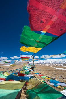 Prayer Flags and the range of Himalaya Mountains in in the background, on the Friendship Highway in Tibet