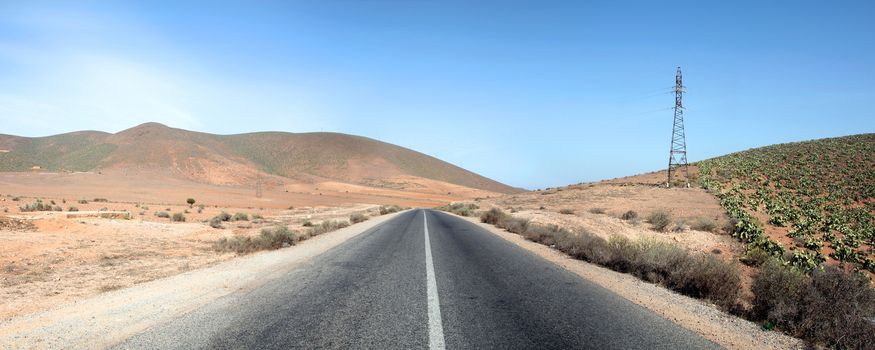 Straight road and landscape in the south of Morocco.