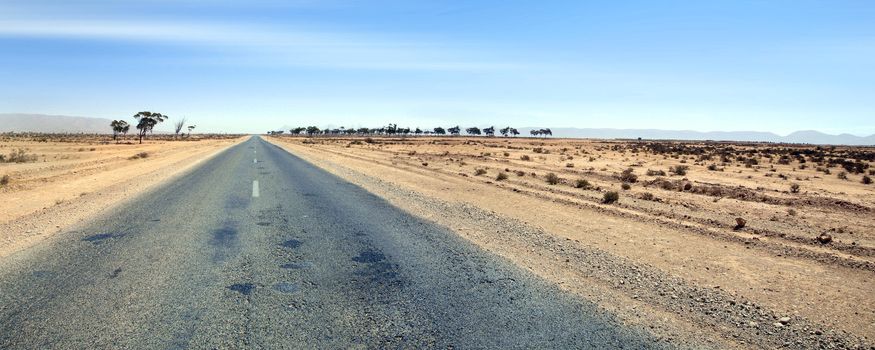 Straight road in the south of Morocco.