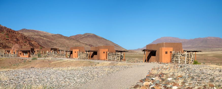 Five individual rooms in a Lodge facing the valley and the desert of Namibia - Puros, Conservation area in Kaokoland, Namibia.