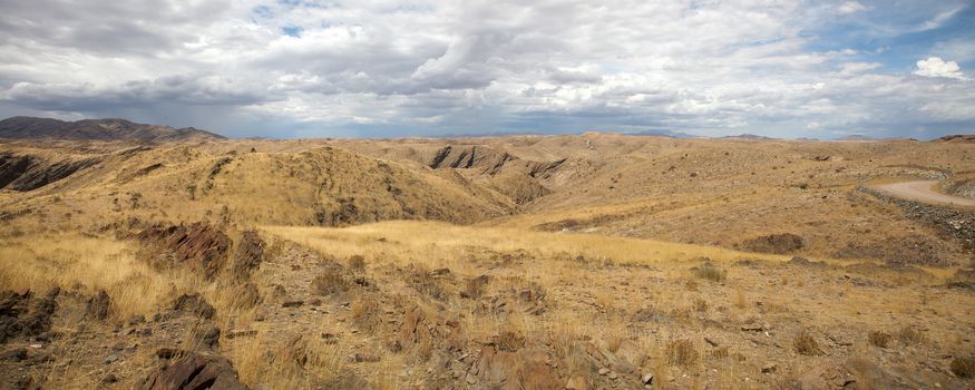 Surreal panorama of the Namib desert going towards Solitaire and Sossusvlei, Namibia.