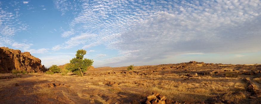 Panorama view of the Bandiagara cliff with an impressive sunset, Mali.