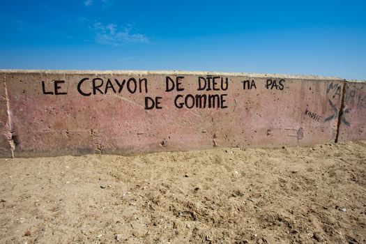 Message on a wall saying that the pencil of god has no gum eraser in Saint Louis, Senegal, 2010