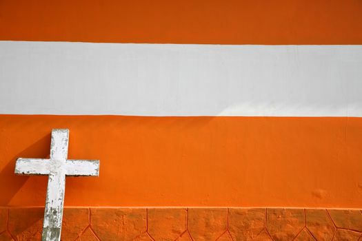 White Cross on Urban orange Brick Church in Kerala, India