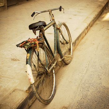 Old bicycle in the street, retro look
