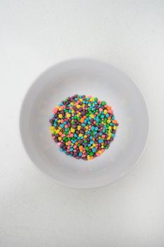 Food decorating sprinkles isolated on a kitchen bench