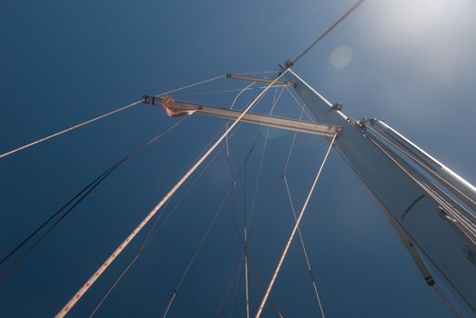 Sailing boat mast against the background of blue skies