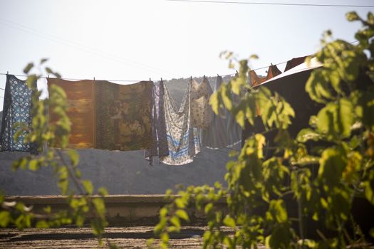 Drying linen hanging on a rope in the sunlight 