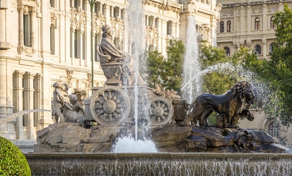 Famous Cibeles fountain at center square between Paseo del Prado and Alcala street in Madrid, Spain