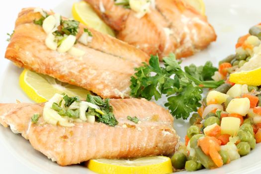 seafood salmon with lemon and vegetables