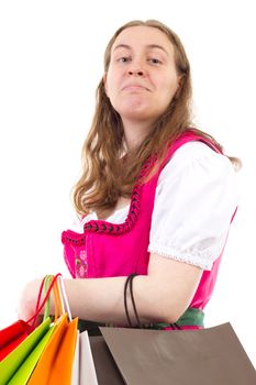 Young woman in dirndl addicted to shopping