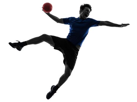 one caucasian young man exercising handball player in silhouette studio on white background