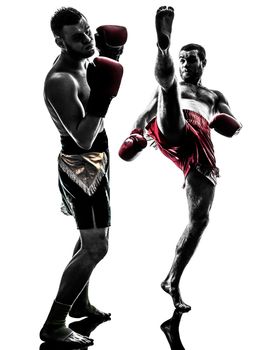 two caucasian men exercising thai boxing in silhouette studio on white background