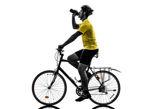 one caucasian man exercising bicycle mountain bike drinking  on white background