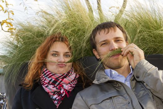 Outdoor happy couple in love, Museum Plein, autumn Amsterdam background