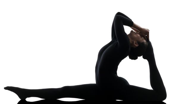 one caucasian woman contortionist practicing gymnastic yoga in silhouette  on white background
