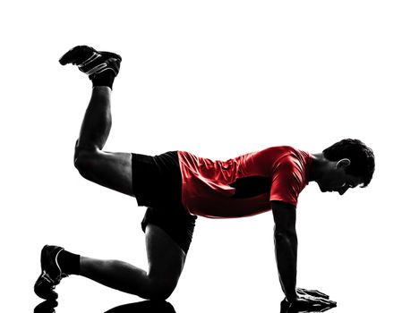 one man exercising fitness workout plank position in silhouette on white background