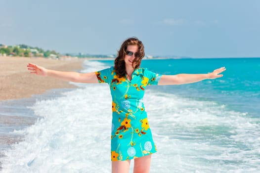 girl with arms wide open in the beautiful dress