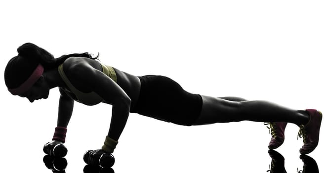 one woman exercising fitness workout push ups in silhouette on white background