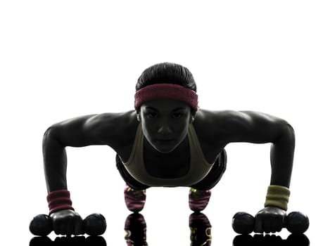 one woman exercising fitness workout push ups in silhouette on white background