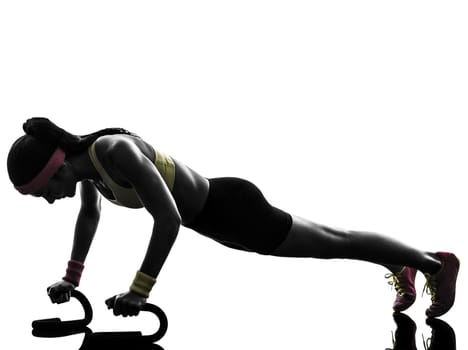 one woman exercising fitness workout push ups in silhouette on white background