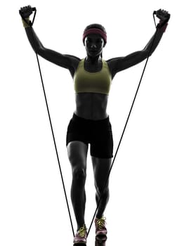 one woman exercising fitness workout resistance bands in silhouette on white background