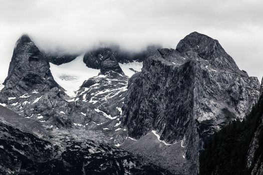 Huge rock in Alps mountains b&w view