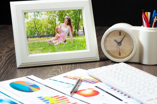 photo frame, keyboard and business paper. Workplace of the businessman.