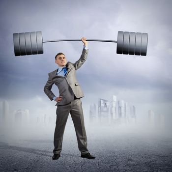 businessman holding a barbell with one hand, the concept of achievements in business