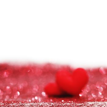 Valentines day decorative hearts on red glitter background