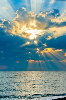 Vertical shot of a beautiful sky with sun rays