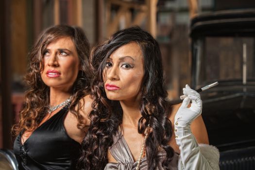 Two beautiful Latino women in retro style dresses