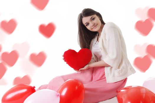 Young girl with red balloons on heart-shaped bokeh background