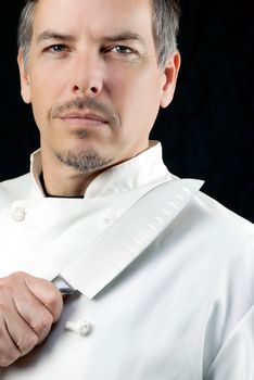 Close-up of a chef displaying his knife, potrait.