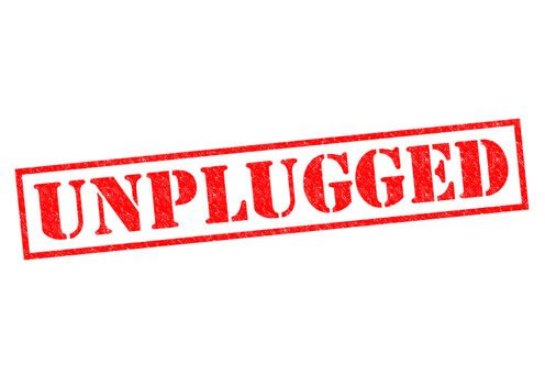 UNPLUGGED red Rubber Stamp over a white background.