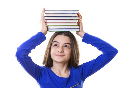 Young girl with stack of books on her head on white background.