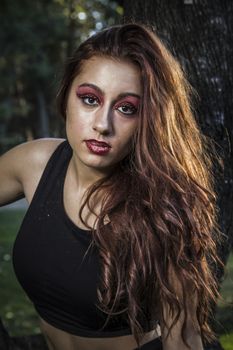 beautiful girl in a vintage style in a fabulous autumn park