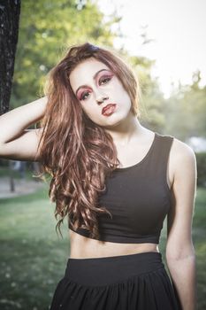 beautiful girl in a vintage style in a fabulous autumn park