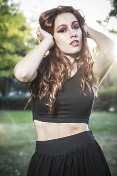 beautiful girl in a vintage style in a fabulous autumn park