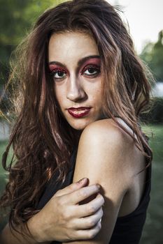 beautiful girl in a vintage style in a fabulous autumn park