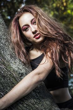 beautiful girl in a vintage style in a fabulous autumn park