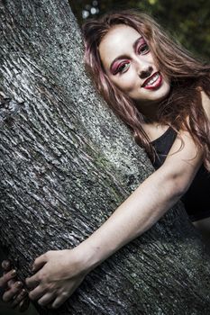 beautiful girl in a vintage style in a fabulous autumn park