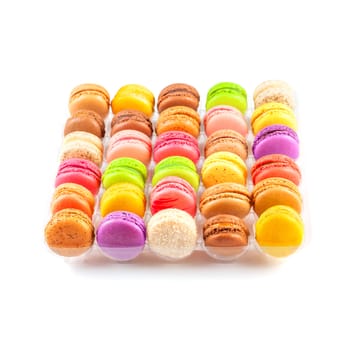 traditional french colorful macarons in a rows in a box